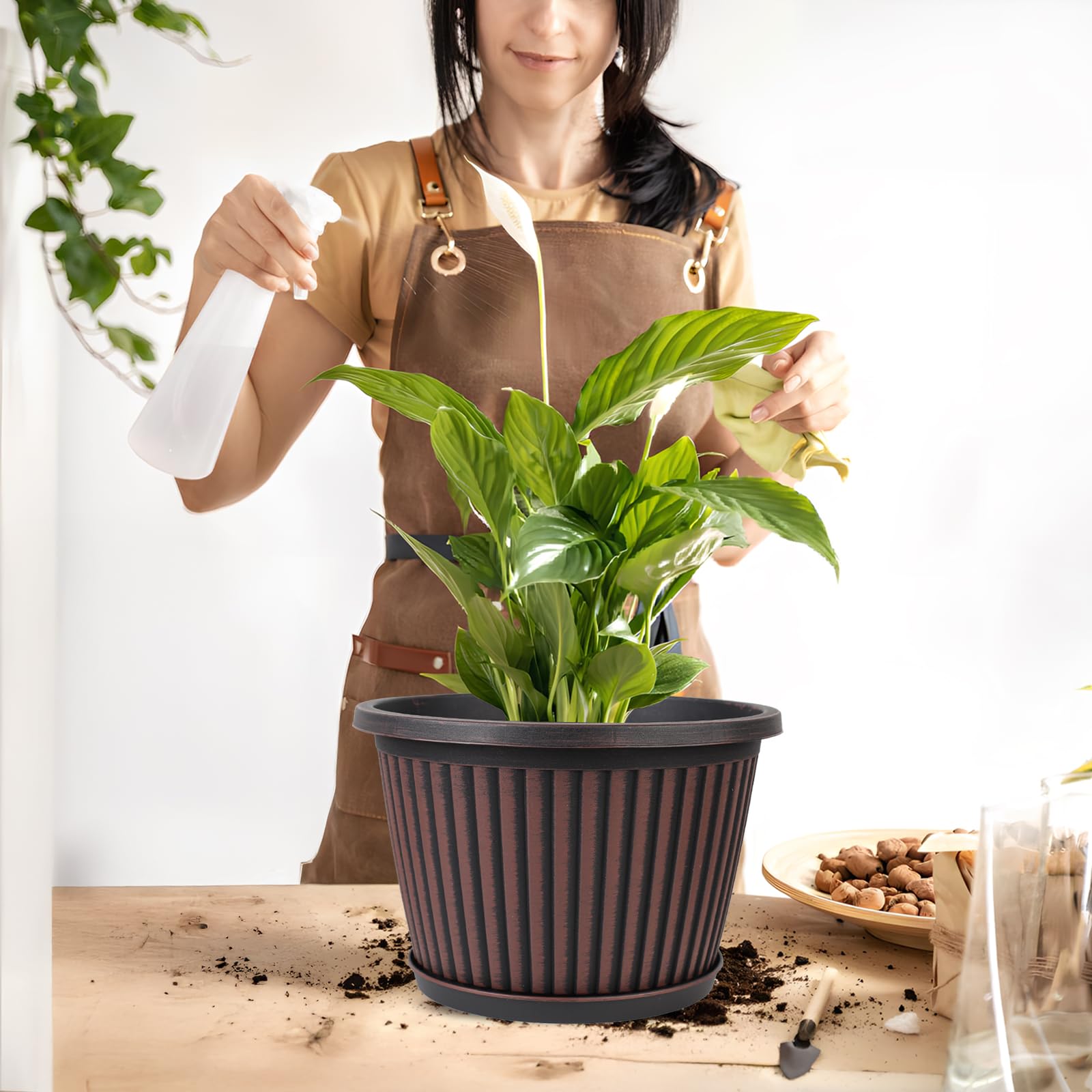 Myfeegoin planter pot with saucer included to catch overflow water.