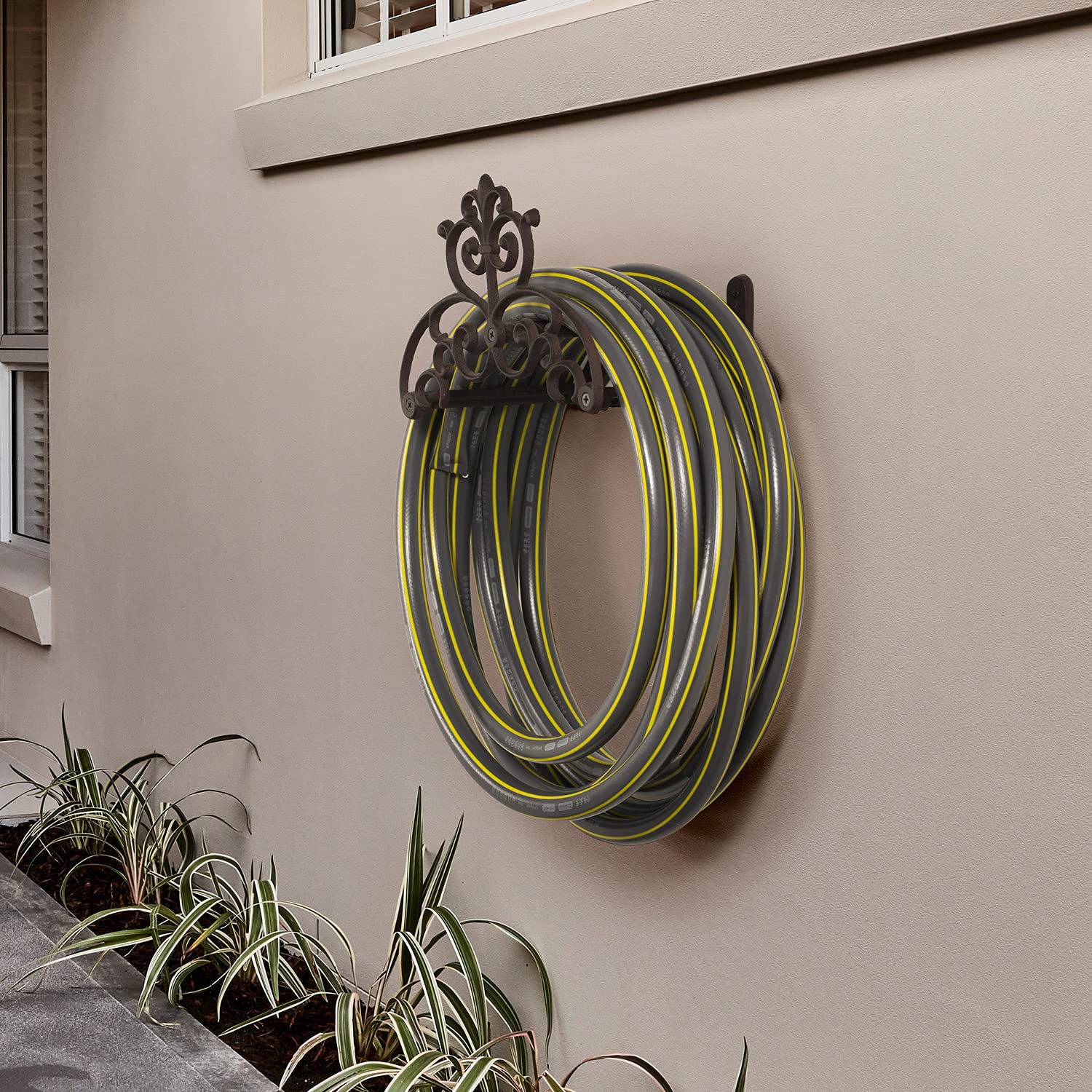 MyGift brown cast-iron hose holder with vintage scrollwork adds curb appeal and order.