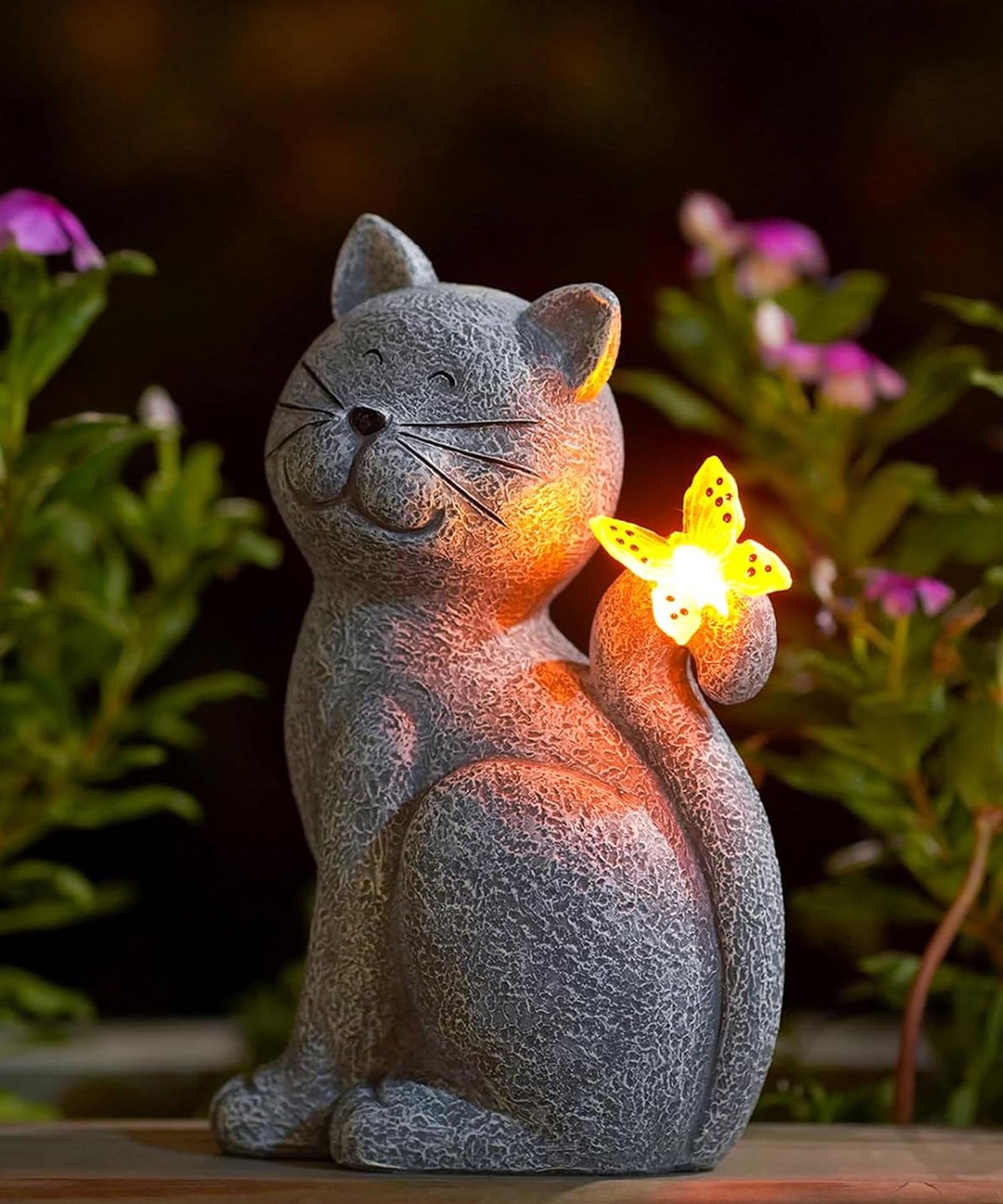 Nacome cat outdoor statue in garden adds charming illumination for evenings.