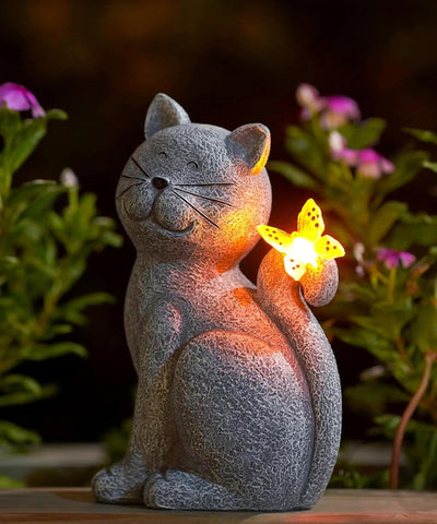 Nacome cat outdoor statue in garden adds charming illumination for evenings.