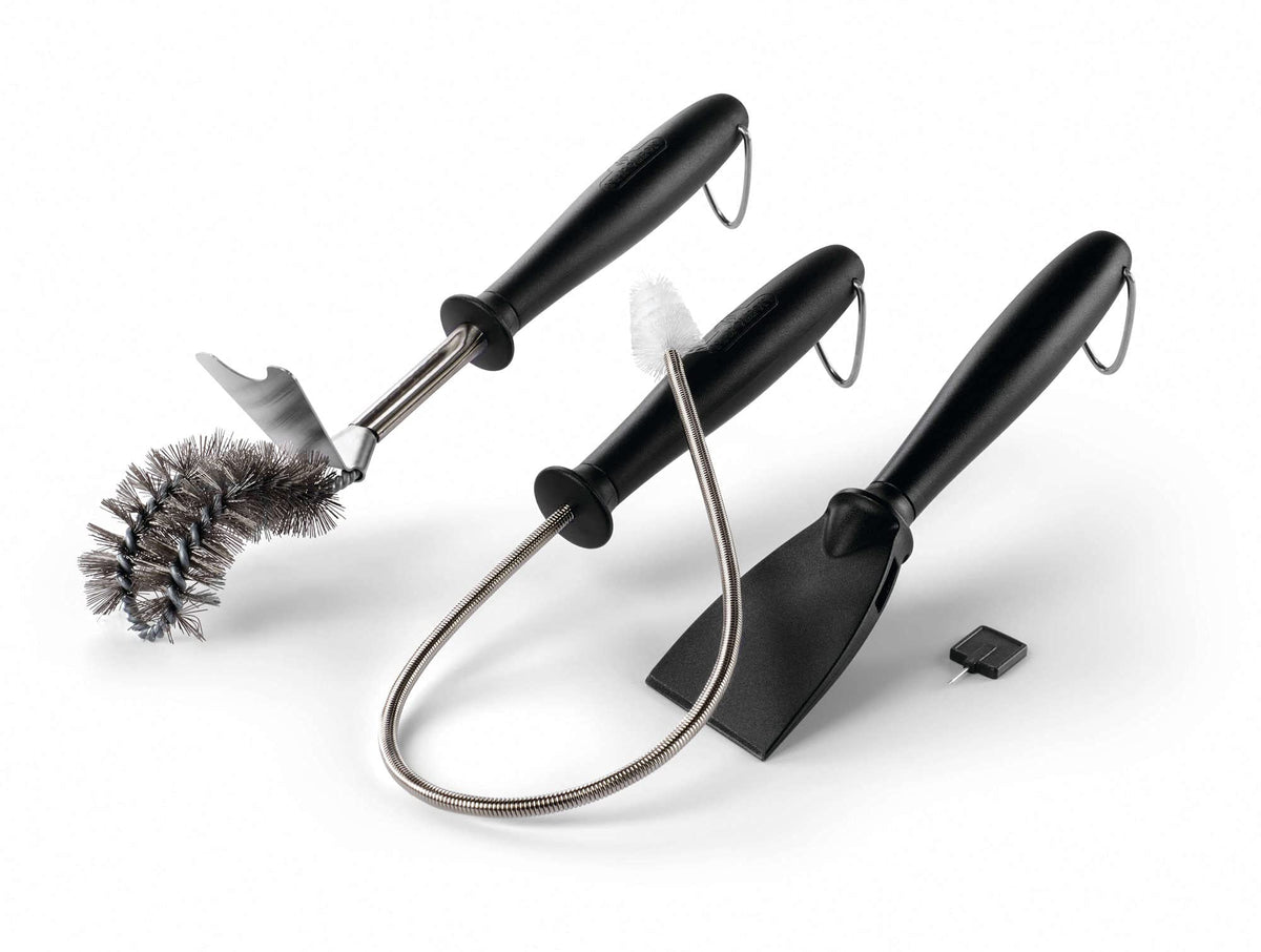 Napoleon angled cleaning brush with grid scraper for thorough grill maintenance.