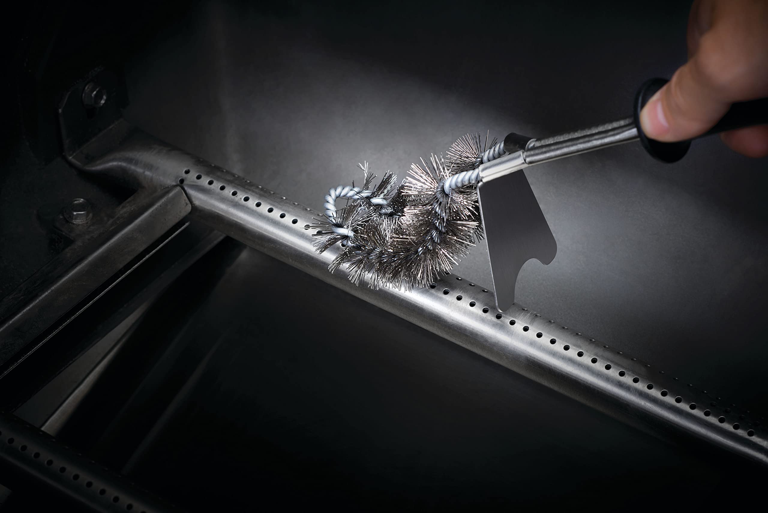 Napoleon burner port cleaner slides out for easy access.