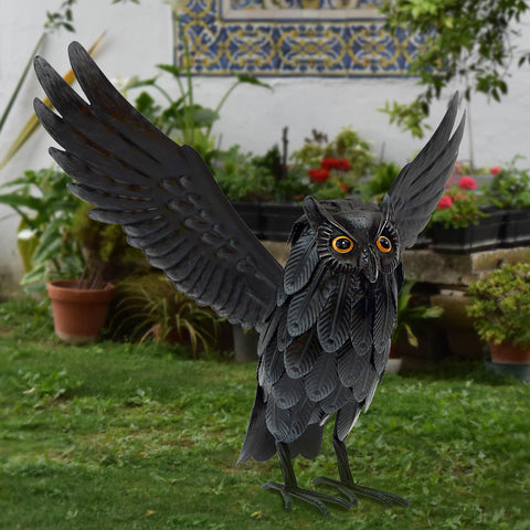 Natelf weatherproof black owl statue stands up to seasonal conditions.