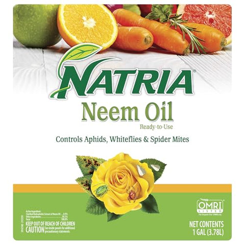 Natria Neem Oil Spray applied in garden to protect outdoor plants from pests.
