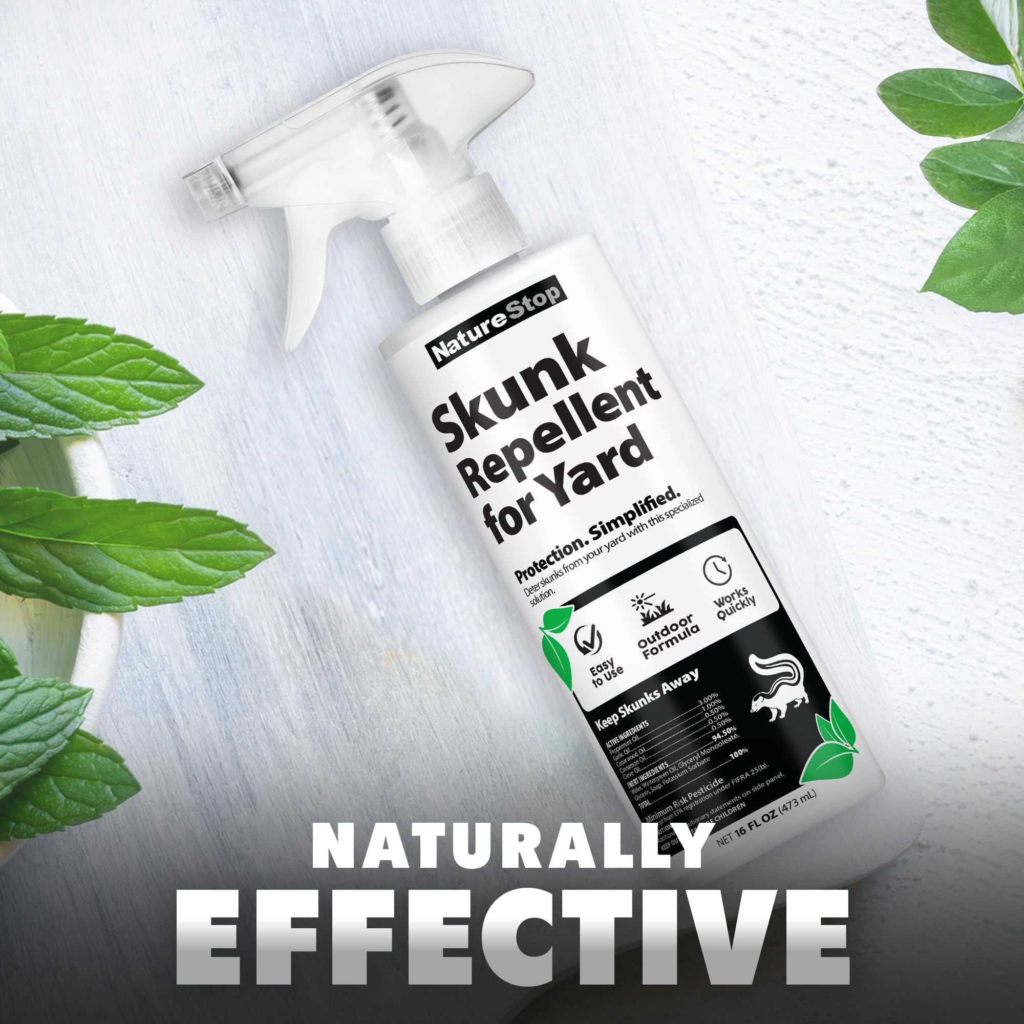 NatureStop bottle used on garden bed borders for ongoing deterrence against skunks.