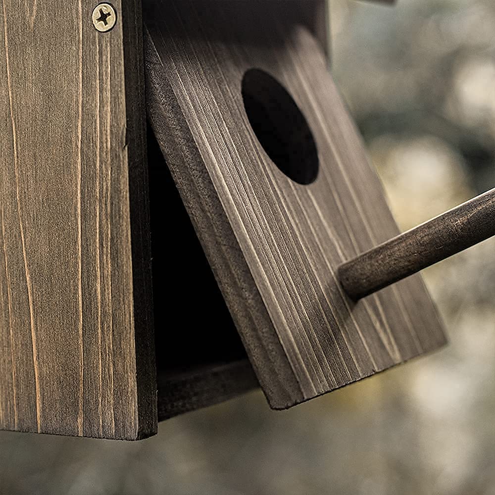NATUREYLWL Weatherproof Bird House rustic finish complements garden decor.