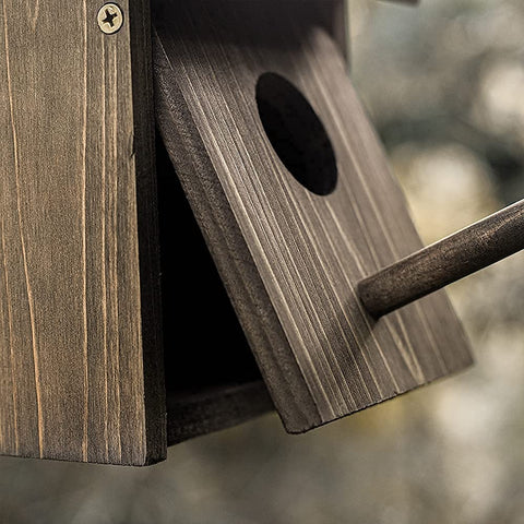 NATUREYLWL Weatherproof Bird House rustic finish complements garden decor.