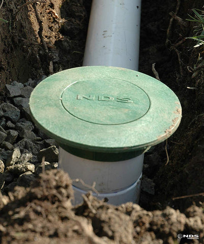 Debris guard on the NDS 420 pop-up emitter protects the pipe