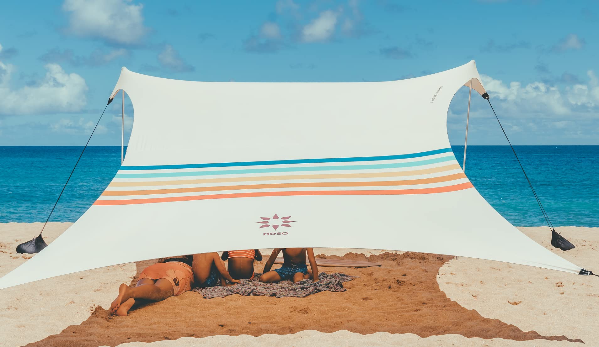 Neso portable rainbow beach tent sun shade for family outings.