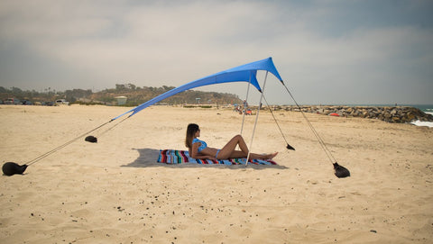 Neso sand anchor bags secure the tent on windy shores.