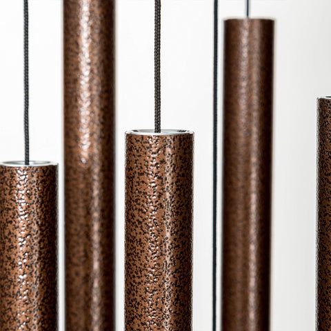 NETAEX chimes displayed in garden for serene ambiance and reflection