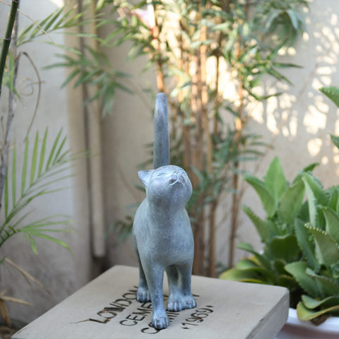 Newman House Studio cat figurine enlivening garden decor