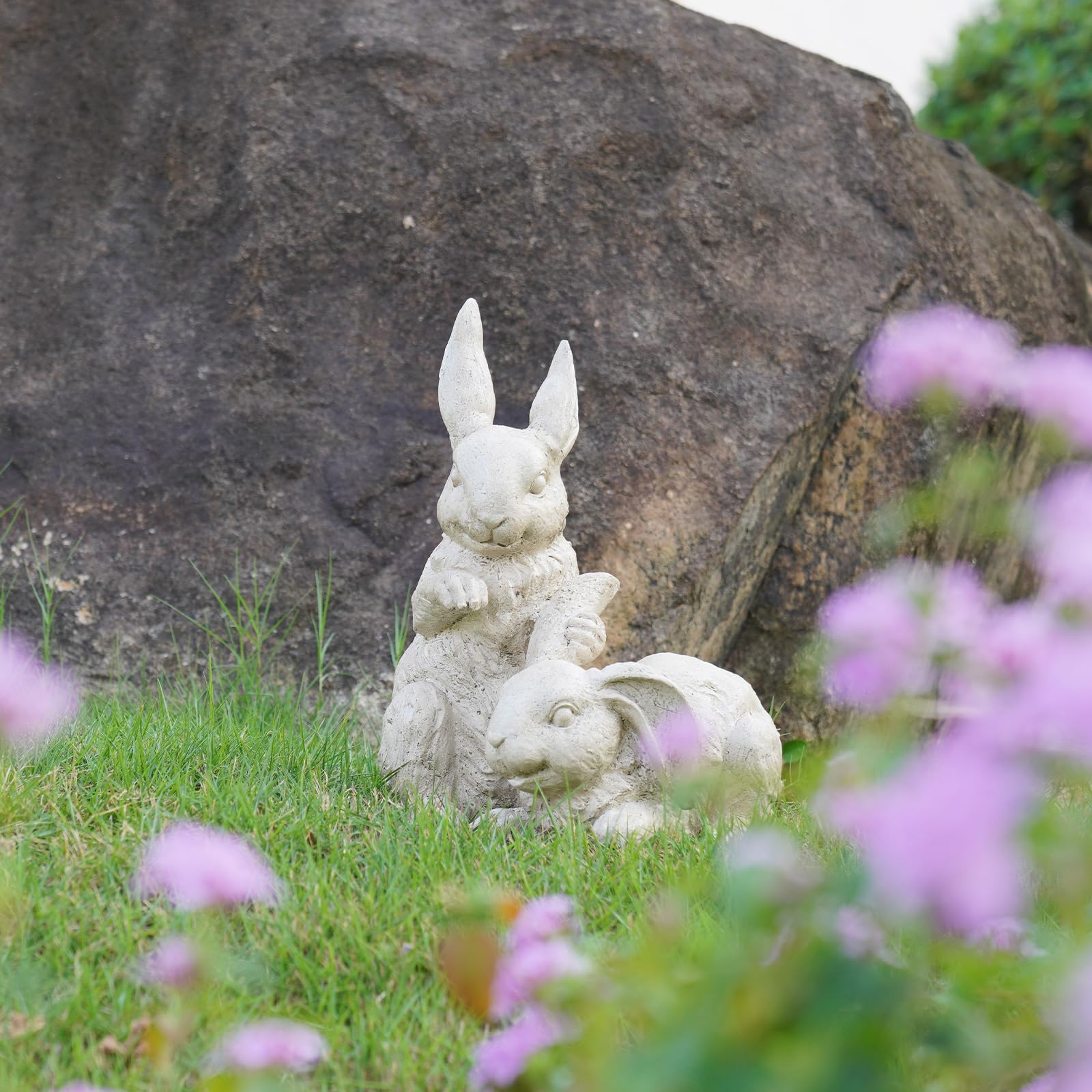 Newman House Studio charming garden sculpture with friendly bunny expression.