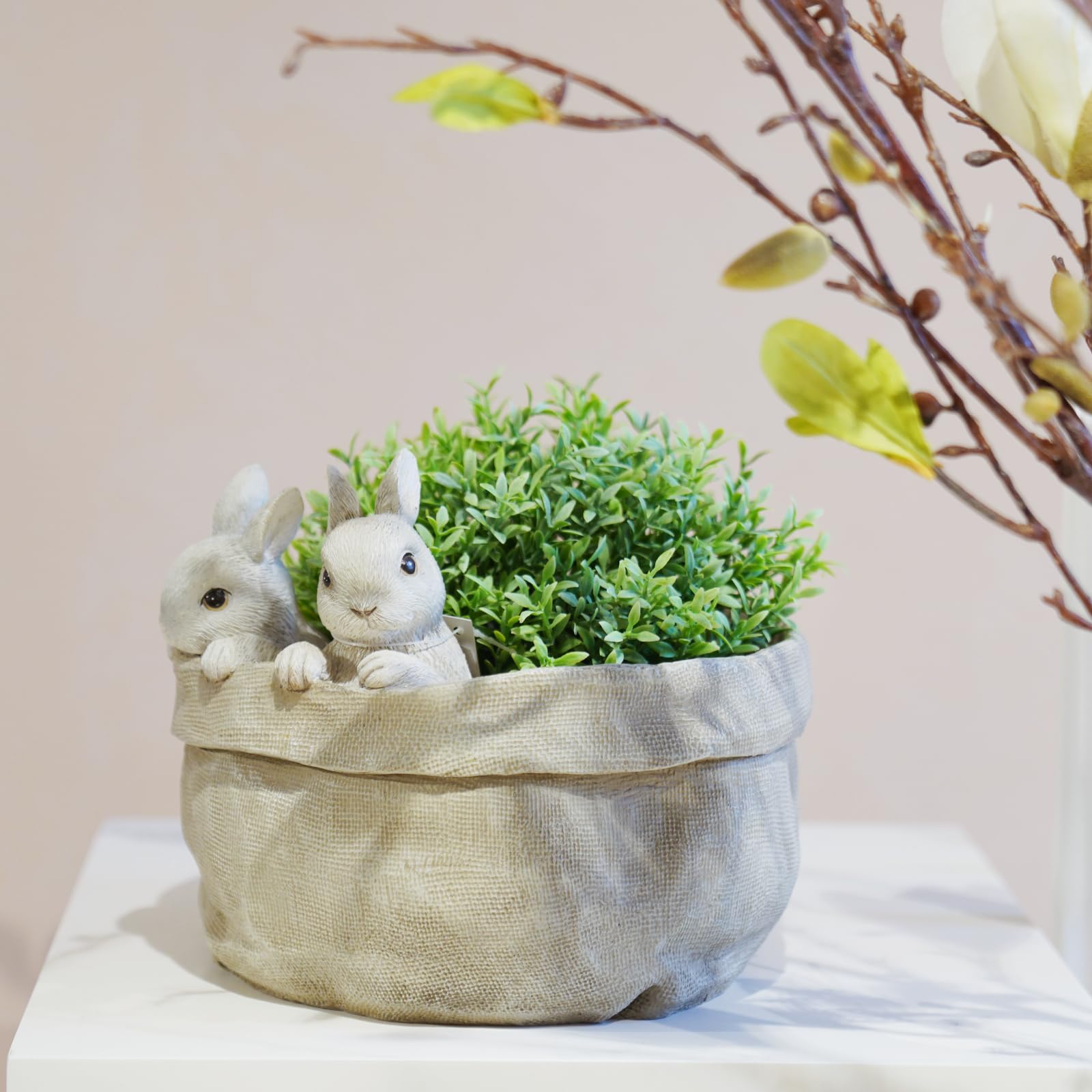 Newman House Studio Easter decor bunny pot pairs with seasonal greens and accents.