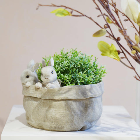 Newman House Studio Easter decor bunny pot pairs with seasonal greens and accents.