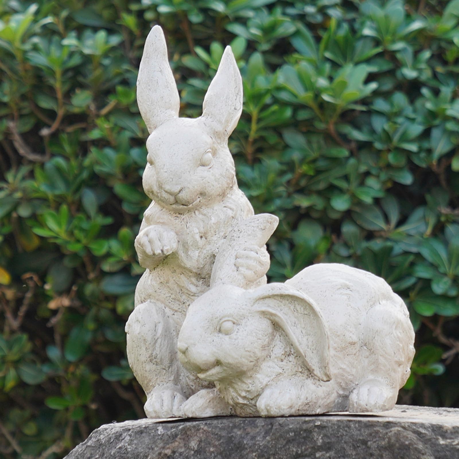 Newman House Studio nestled bunny cream garden statue for outdoor decor.