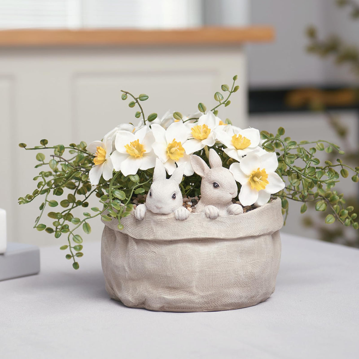 Newman House Studio Spring Bunny Flower Pot adds charm to outdoor gardens with a cute rabbit motif.