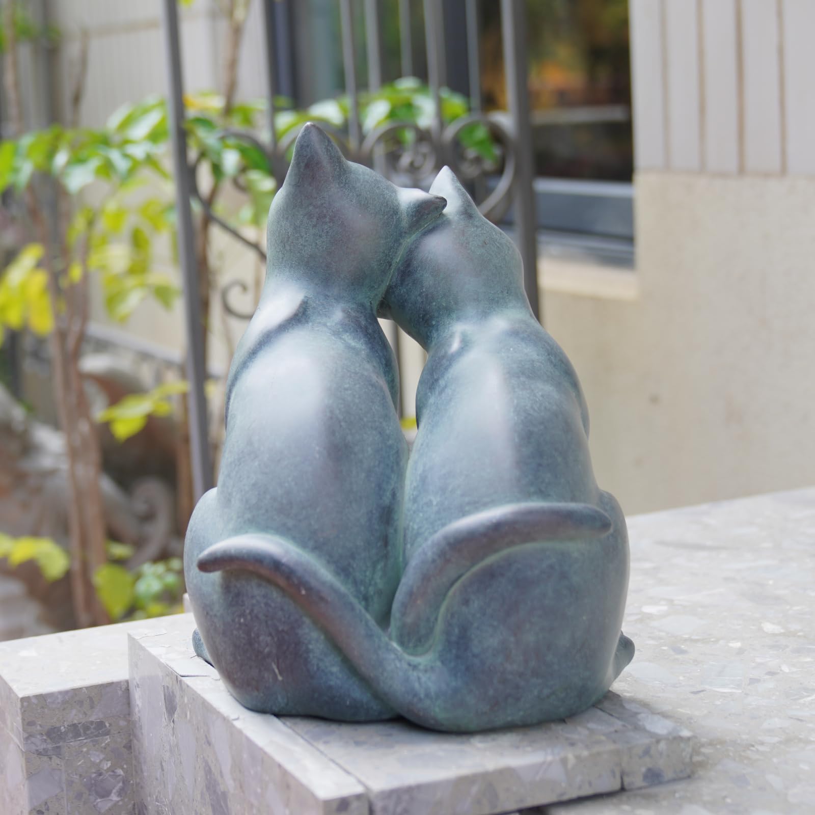 Newman House Studio verdigris patina detail enhances garden decor
