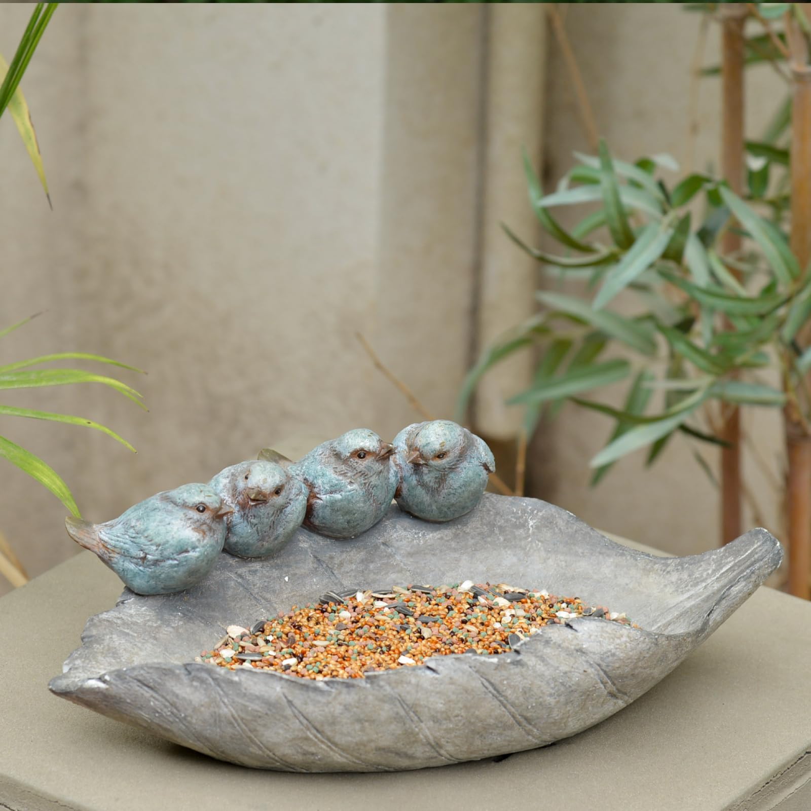 Newman House Studio yard decor bird family design lights up outdoor space