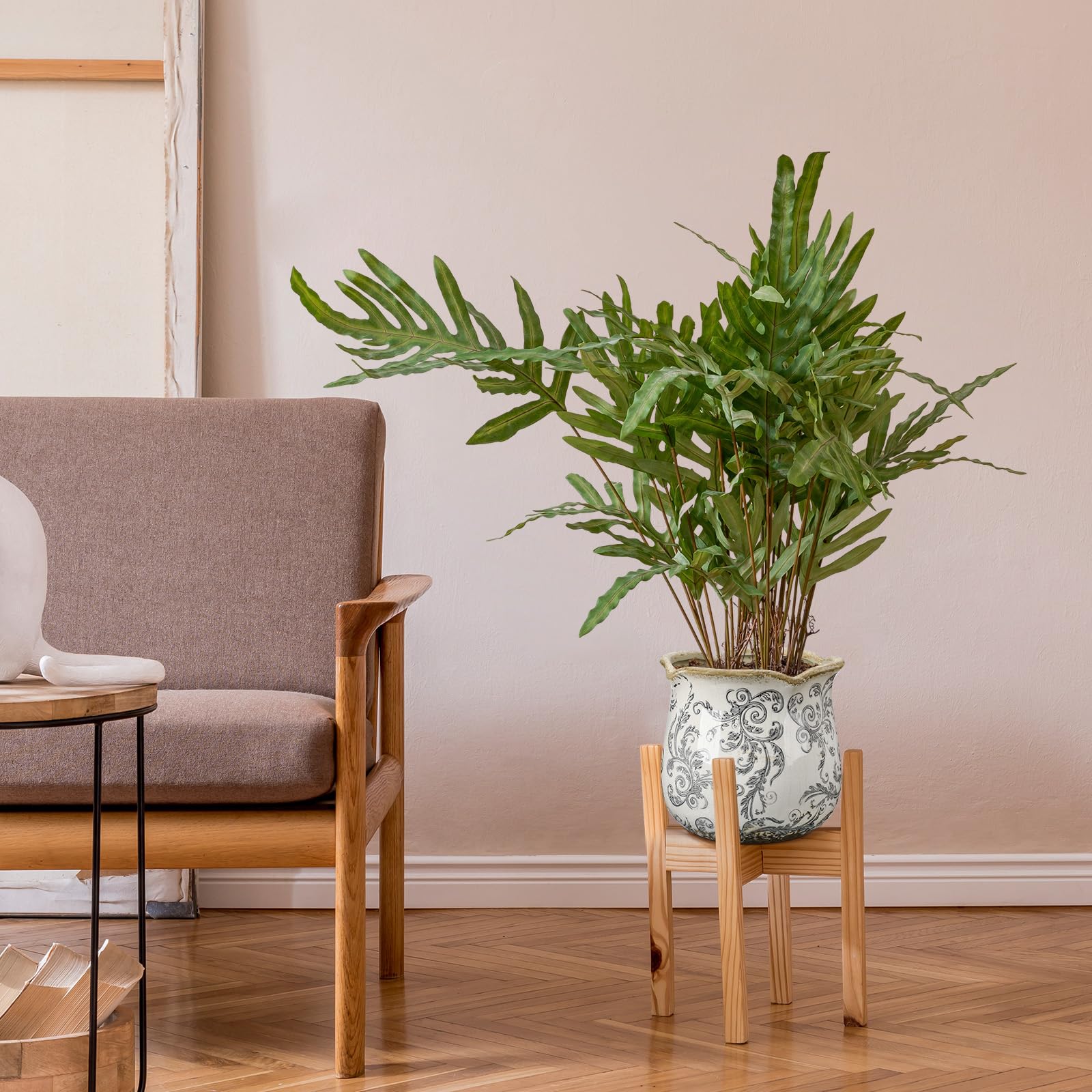 Newtay planter styled as a centerpiece on a table with plants