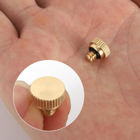 Close-up of easy-install brass nozzle plugs for tool-free setup