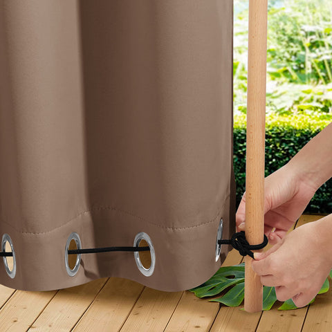 NICETOWN outdoor curtains on a pergola provide privacy and shade in tan-khaki fabric