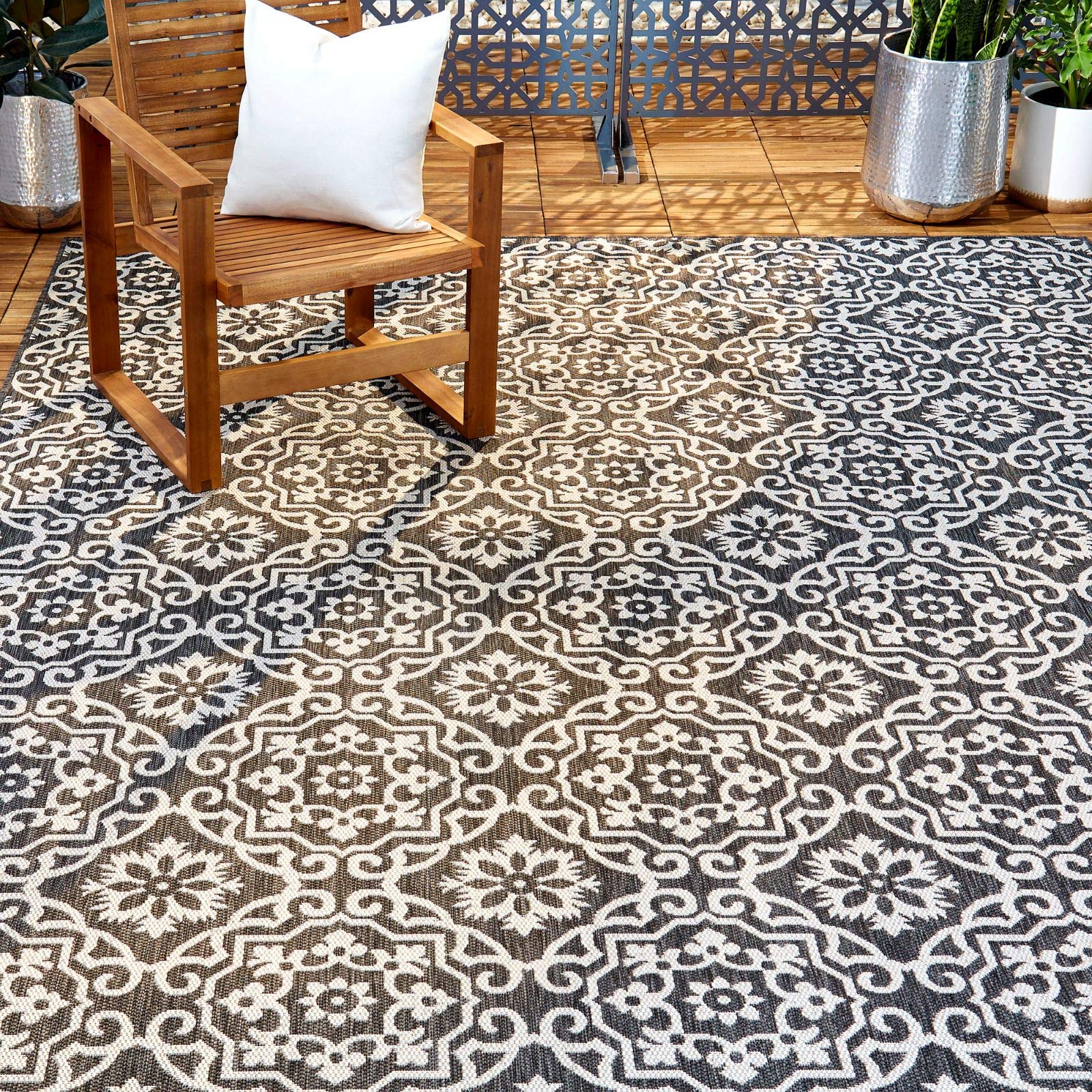 Nicole Miller New York Danica rug on outdoor deck adds style and comfort.