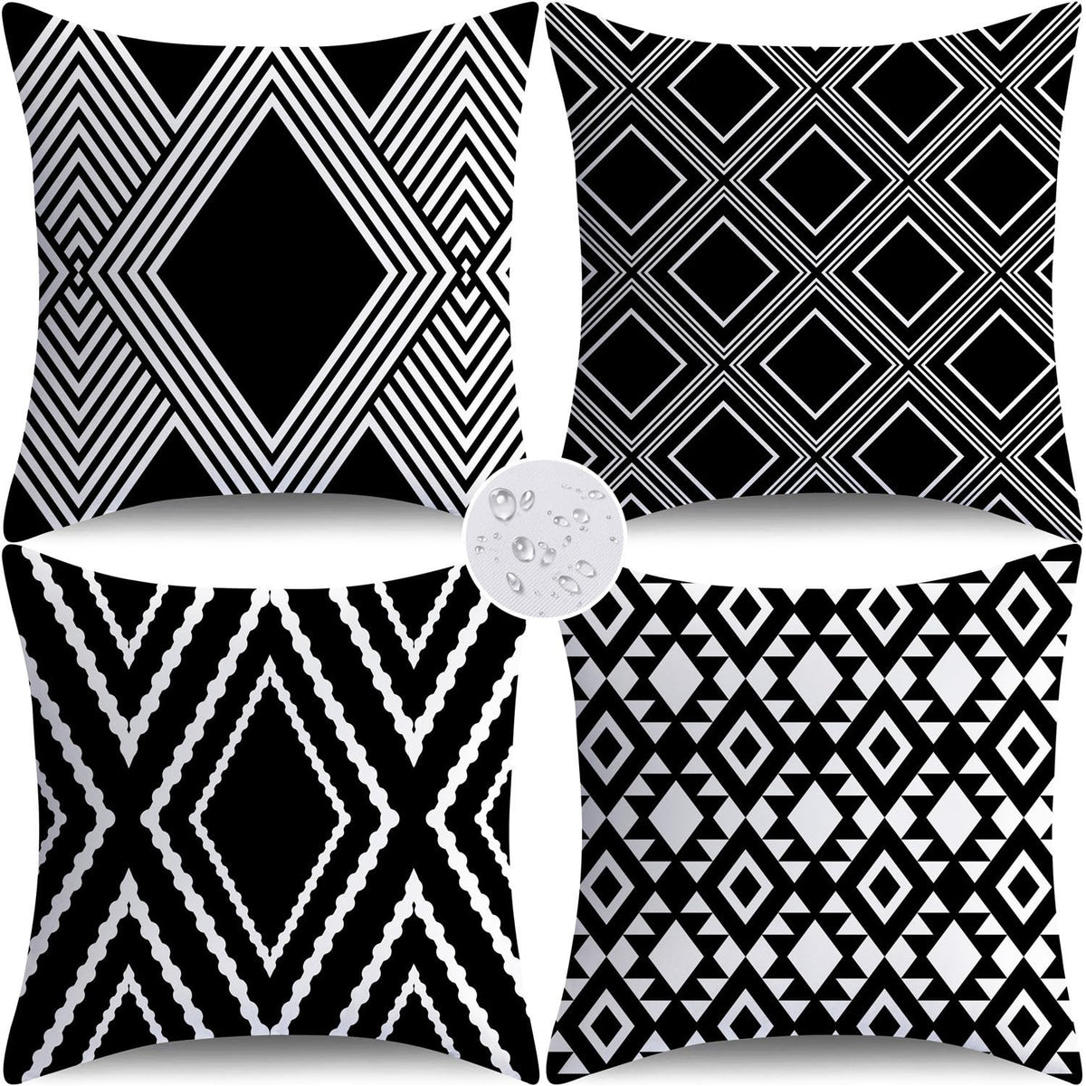 Nightwish outdoor pillow cover with black geometry on a patio, water-repellent and durable.