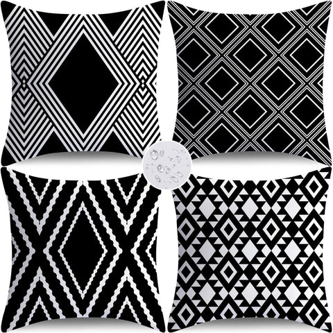Nightwish outdoor pillow cover with black geometry on a patio, water-repellent and durable.