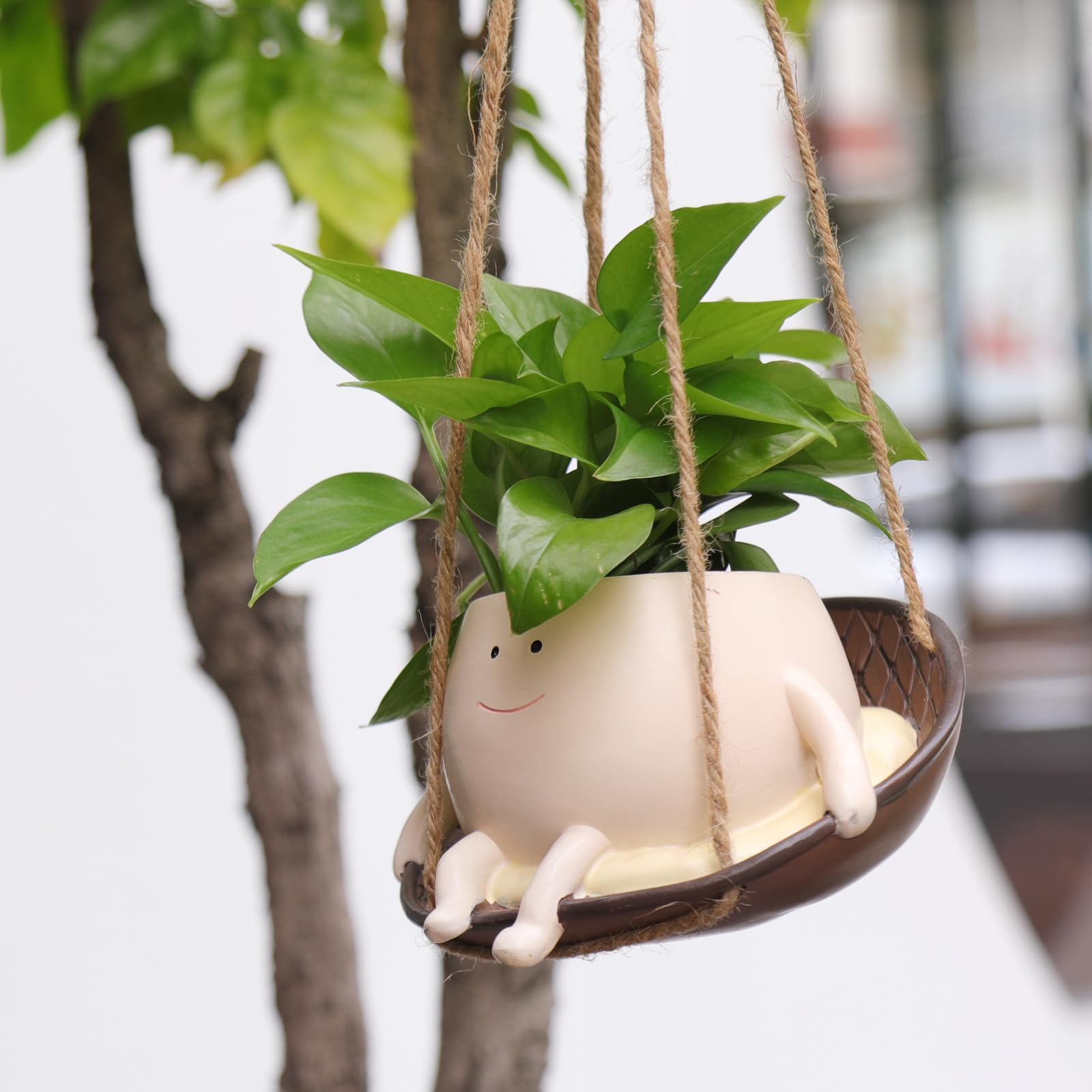 NINIPAPA hanging swing face pot showing a cheerful smile for outdoor terraces.