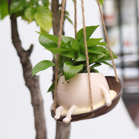 NINIPAPA hanging swing face pot showing a cheerful smile for outdoor terraces.