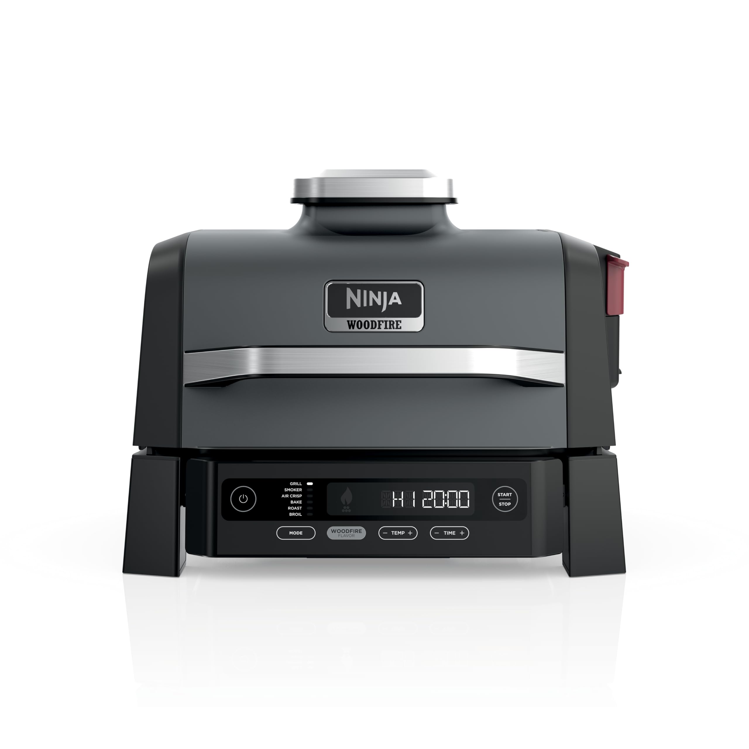 Ninja Woodfire Grill on an outdoor patio shows all-in-one versatility for outdoor cooking.