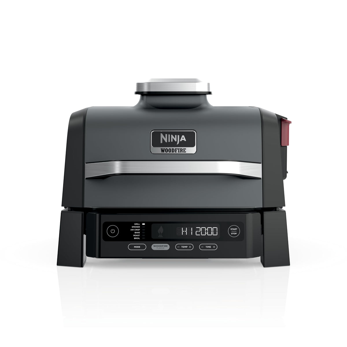 Ninja Woodfire Grill on an outdoor patio shows all-in-one versatility for outdoor cooking.