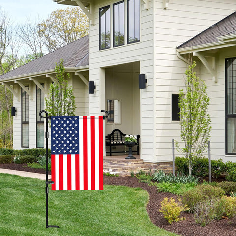 Nirohee outdoor yard decor with flag stand displayed by front porch.