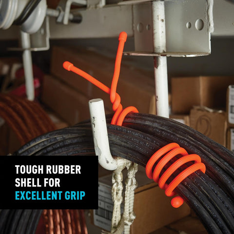 Original Gear Tie organizing a garden lamp cord outdoors for quick use.