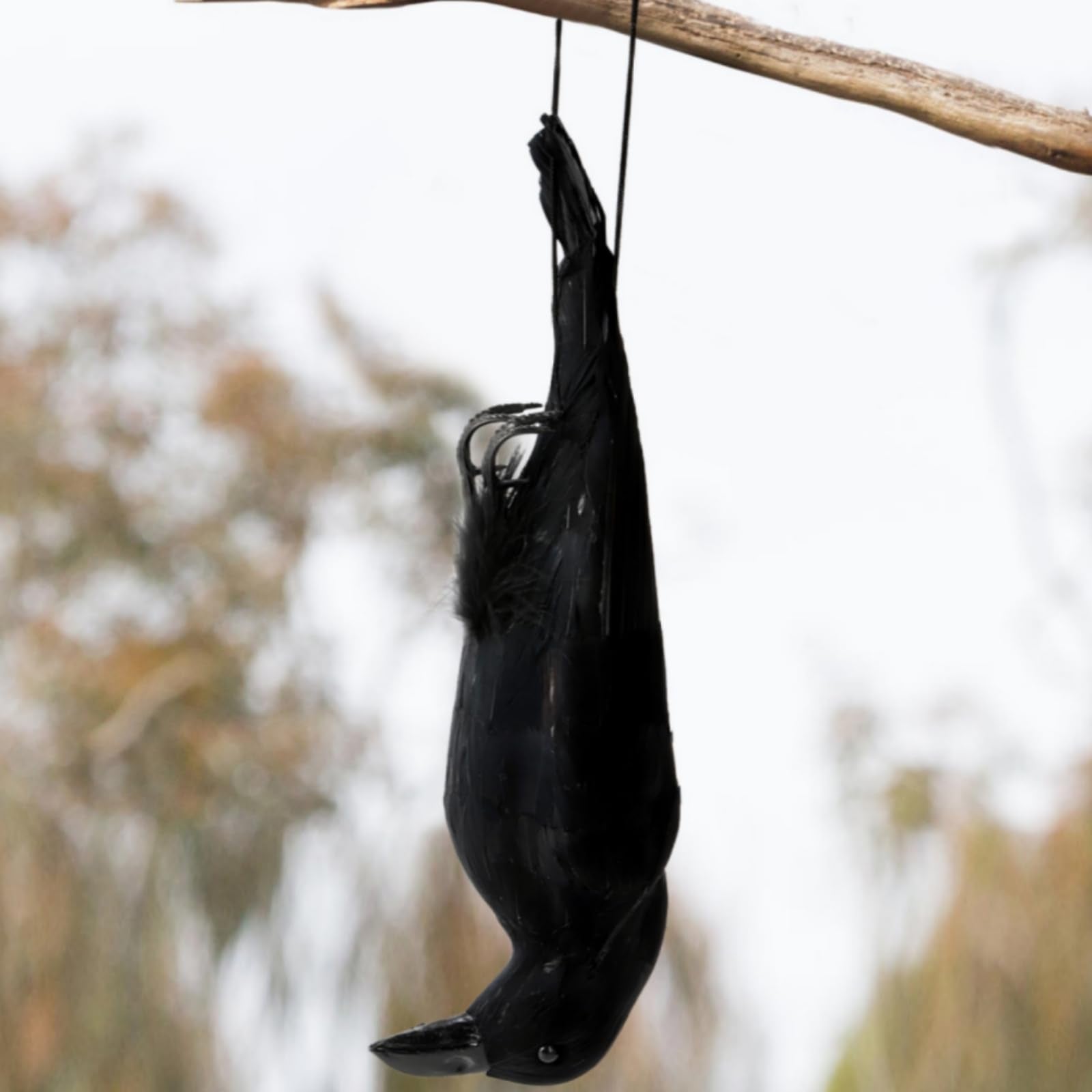 Noamus 17-inch hanging crow with lifelike feathers, ideal for garden deterrence and decor.