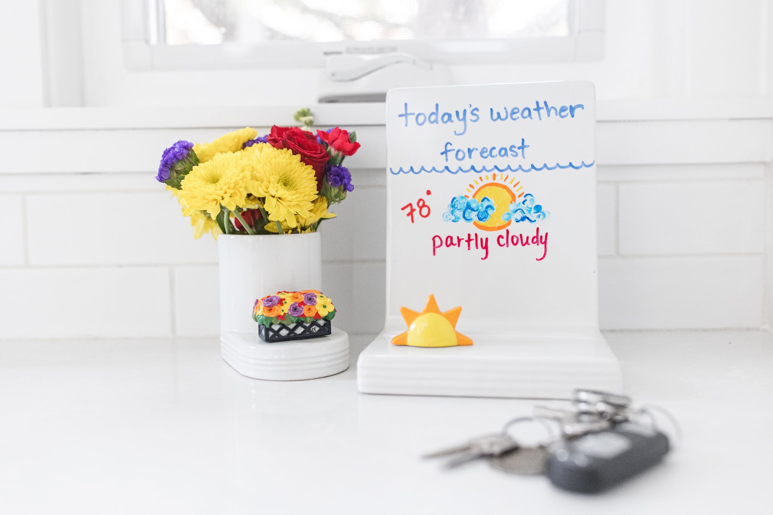 Interchangeable minis fit securely into the base for flexible seasonal displays.