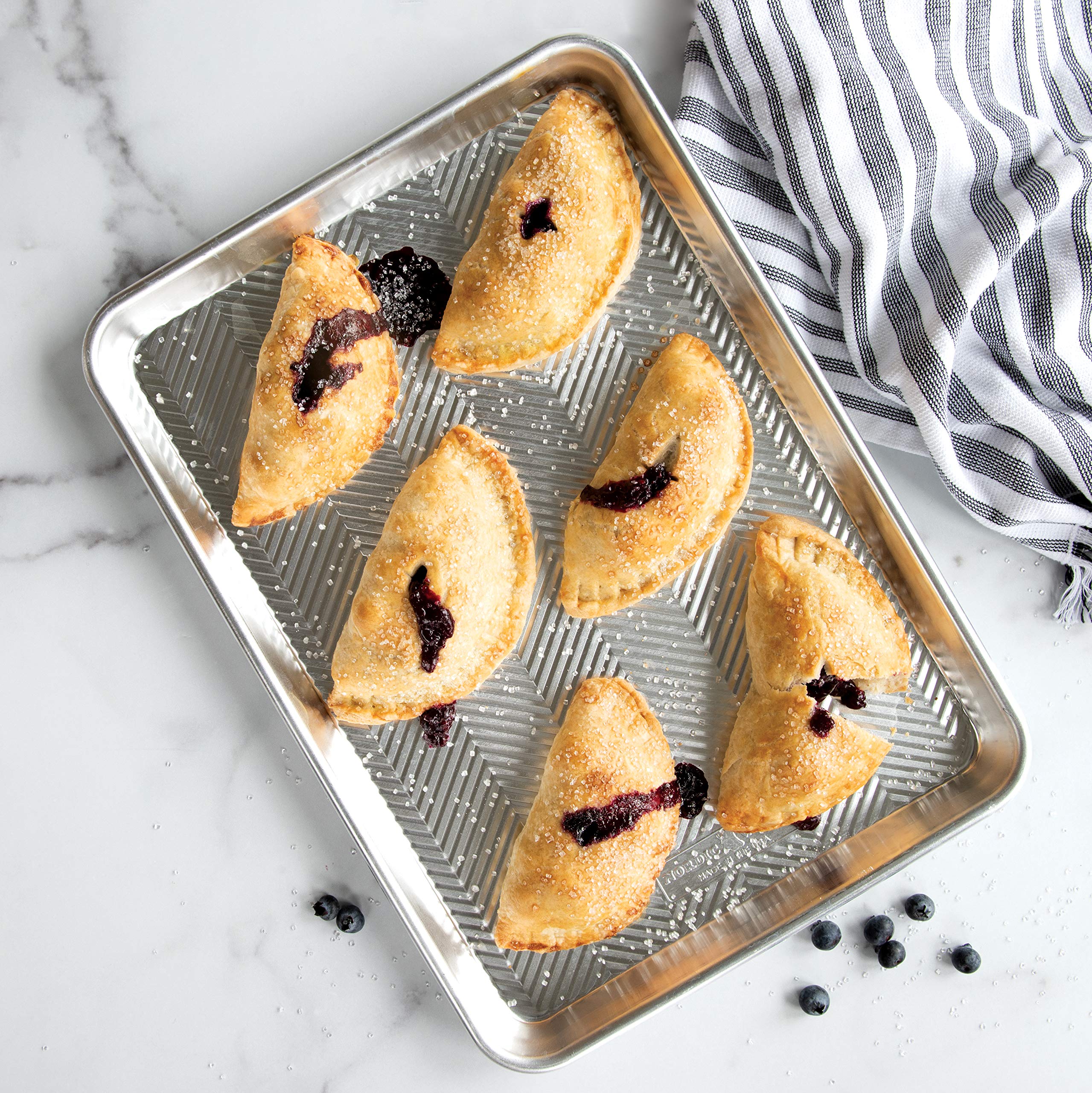 Nordic Ware Pocket Pie Press demonstrates crimp action for uniform edges.
