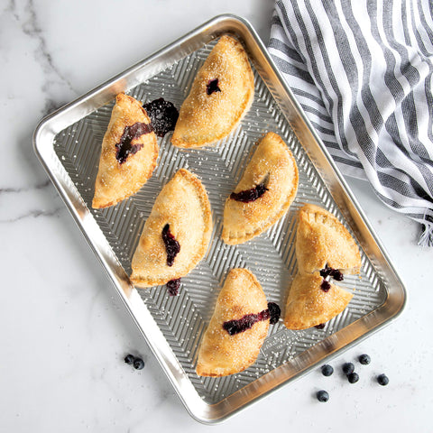 Nordic Ware Pocket Pie Press demonstrates crimp action for uniform edges.