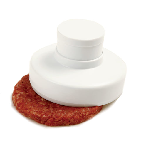 Norpro hamburger press on parchment for easy transfer.
