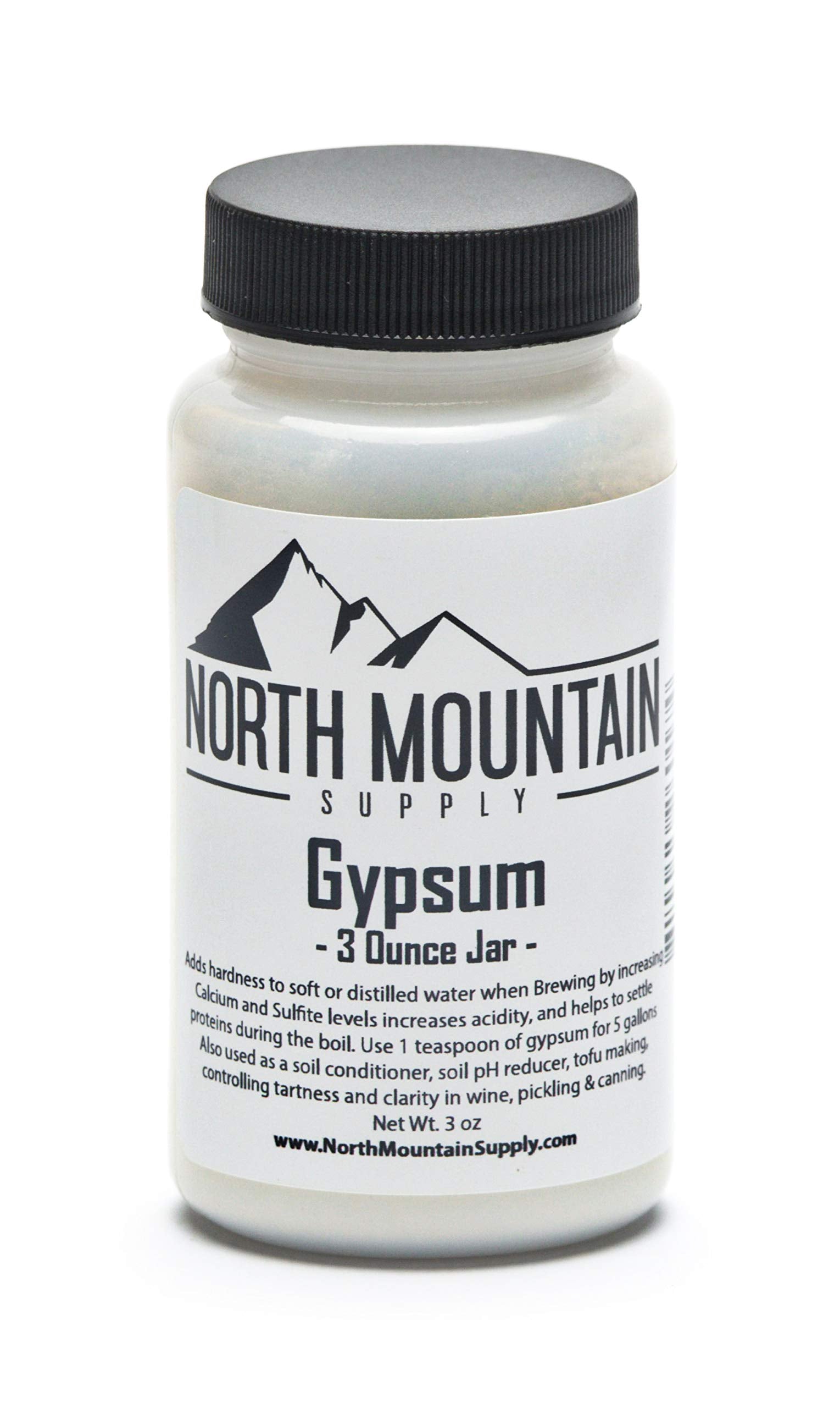 North Mountain Supply gypsum 3 oz jar on countertop, enhances brewing water hardness for better flavor.