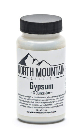 North Mountain Supply gypsum 3 oz jar on countertop, enhances brewing water hardness for better flavor.