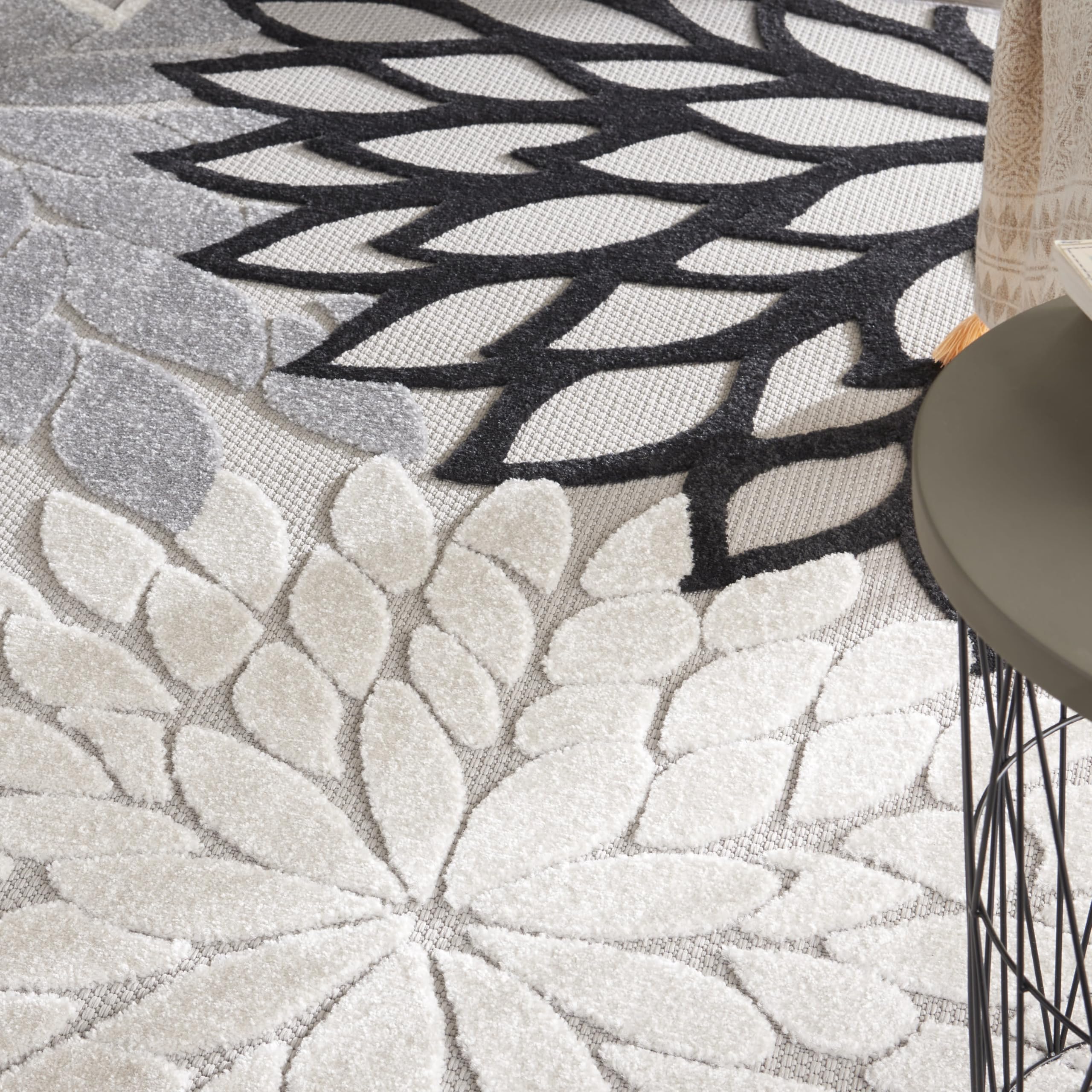 Nourison Aloha black-white rug suits dining rooms and outdoor areas alike.
