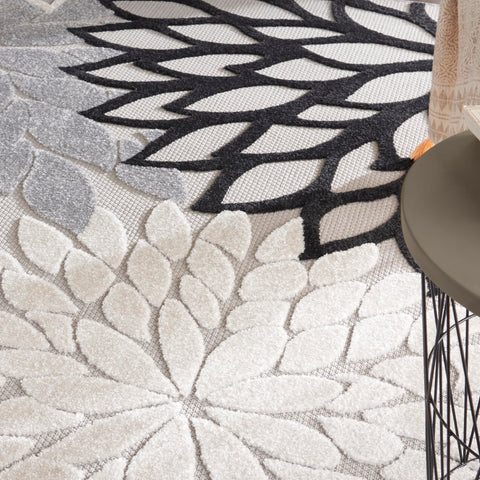 Nourison Aloha black-white rug suits dining rooms and outdoor areas alike.