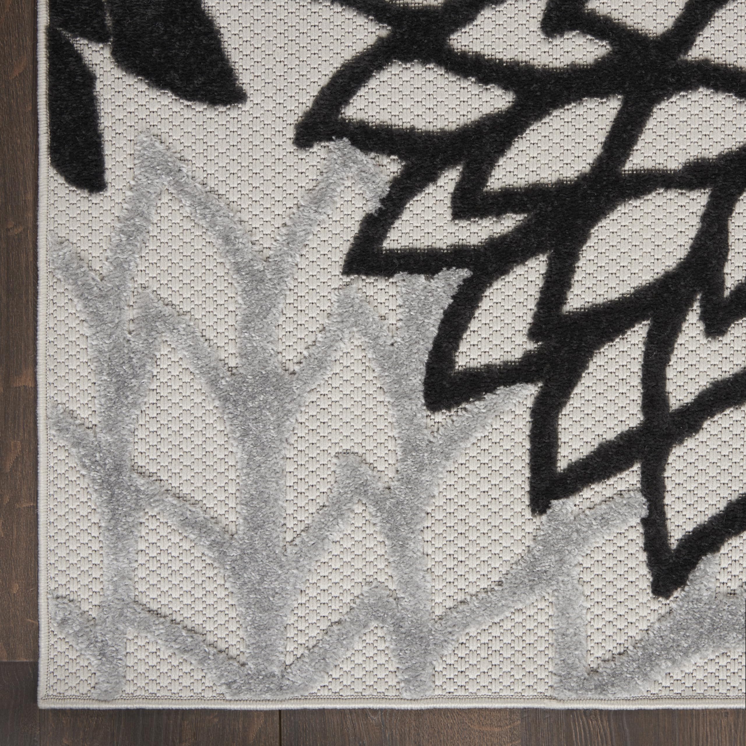 Nourison Aloha easy-cleaning rug supports hose-cleanups after outdoor use.