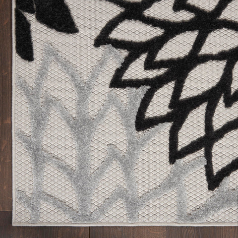 Nourison Aloha easy-cleaning rug supports hose-cleanups after outdoor use.