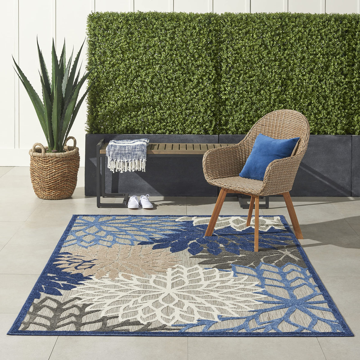 Nourison Aloha floral pattern close-up in blue and multi colors for outdoor use