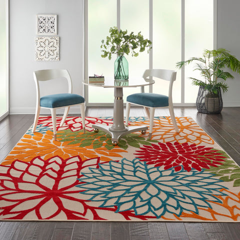 Nourison Aloha green patio rug brings tropical vibes to decks and porches.