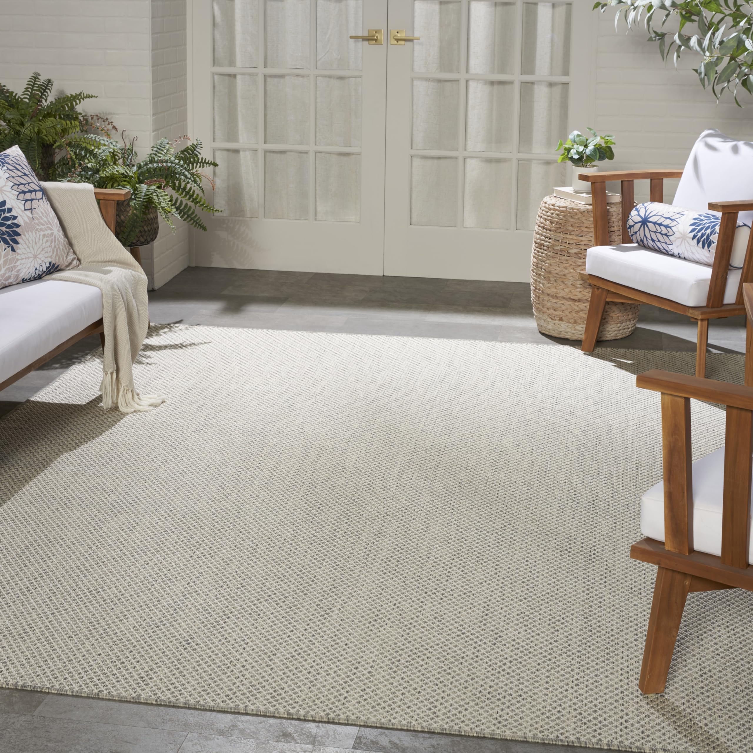 Nourison Courtyard rug on a porch demonstrates outdoor practicality and ease of cleaning
