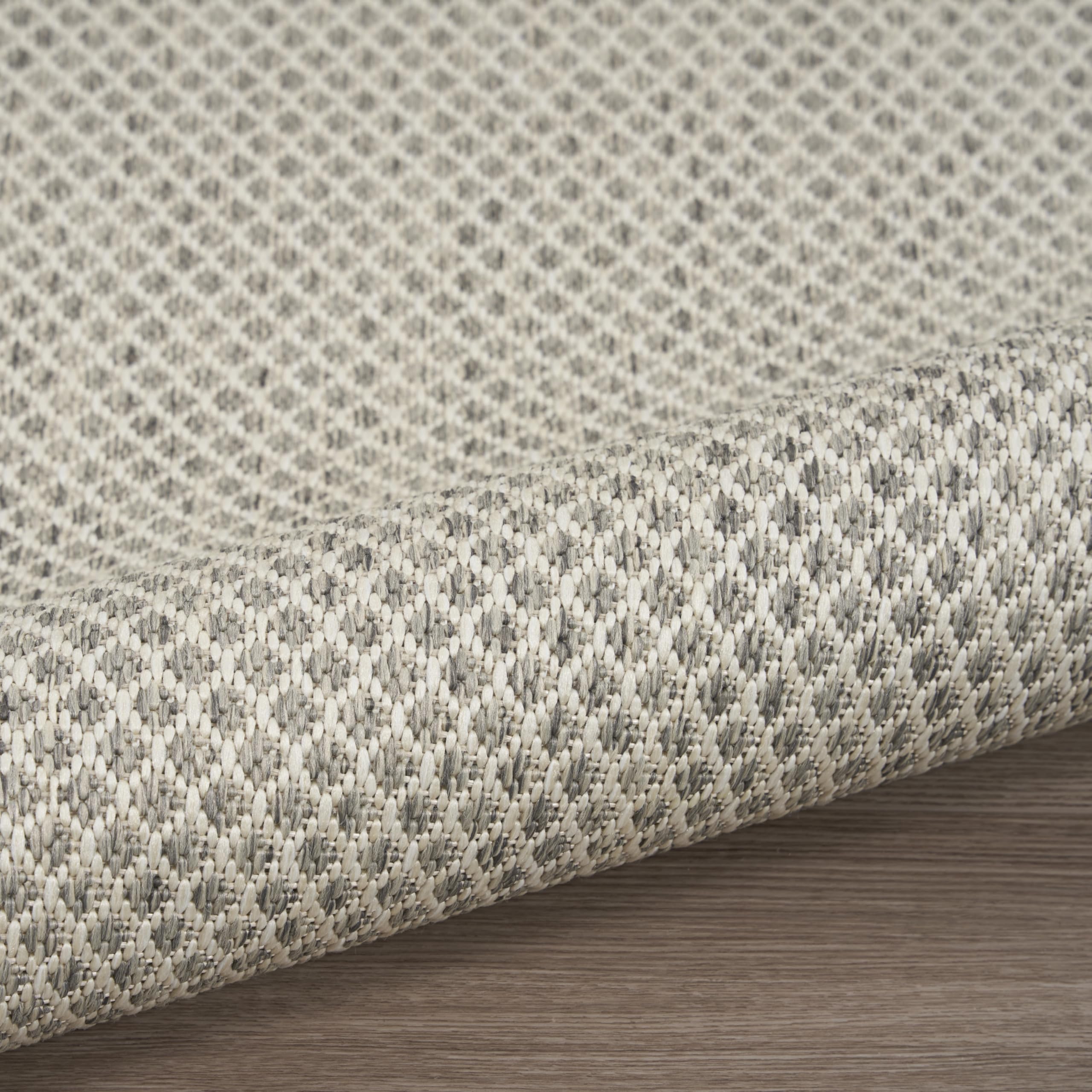 Nourison Courtyard subtle texture detail enhances layered decor